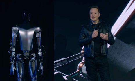 Optimus podnosi ciężkie pudełko Robot Optimus podnoszący ciężkie pudełko