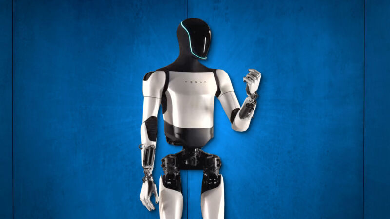 humanoid Tesli ćwiczy precyzję Humanoid Tesli ćwiczący precyzję w chwytaniu przedmiotów
